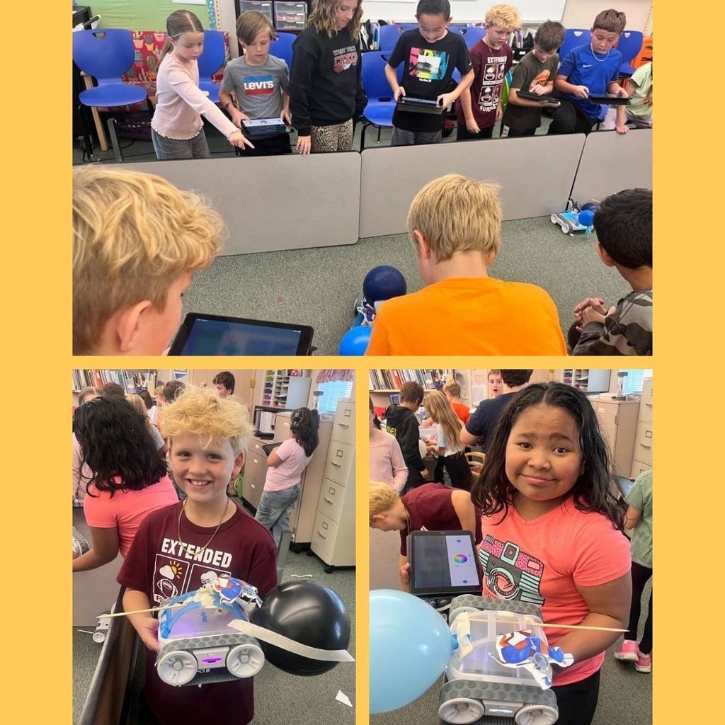 Students holding Sphero Robots made into jousting knights.