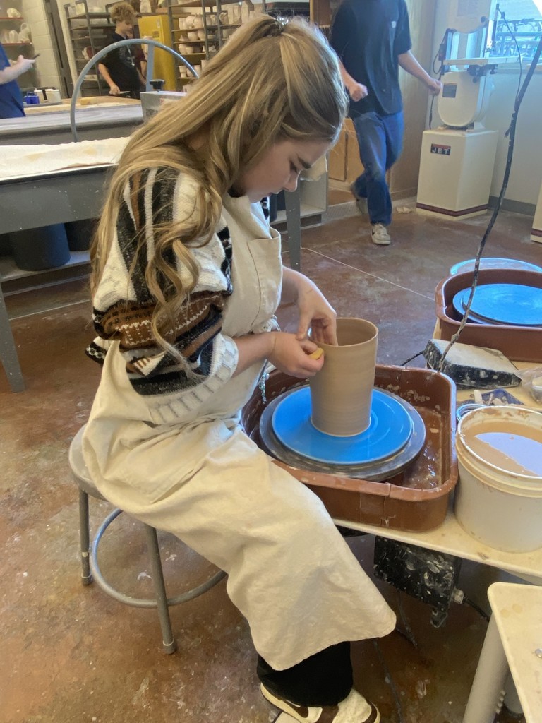 A Syracuse High student doing pottery. 