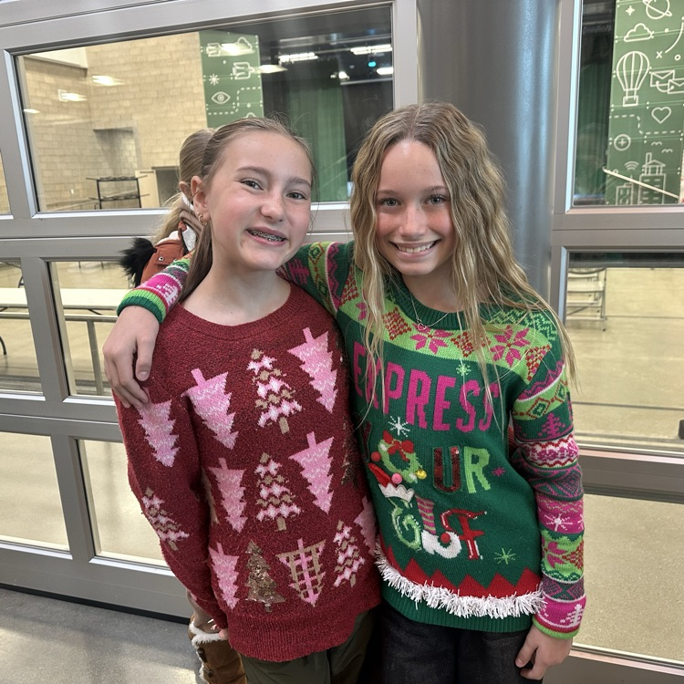 2 girls with Christmas sweaters