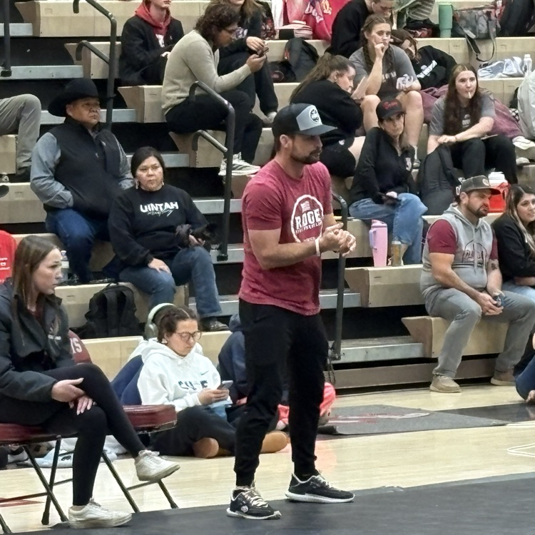 coach Kennington inspiring the wrestlers 