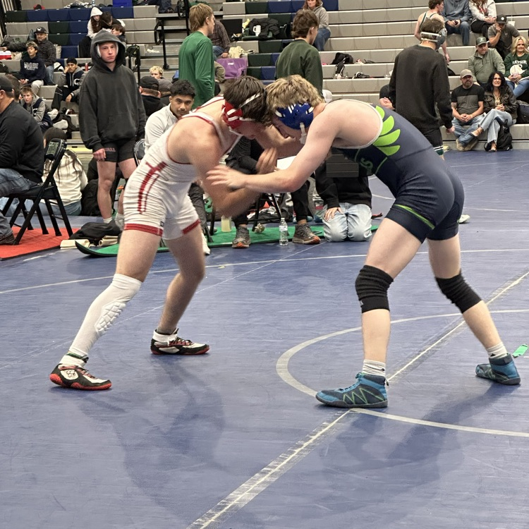 boys wrestling on a mat
