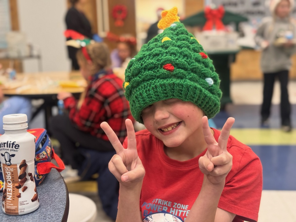 Student wearing Christmas tree beanie