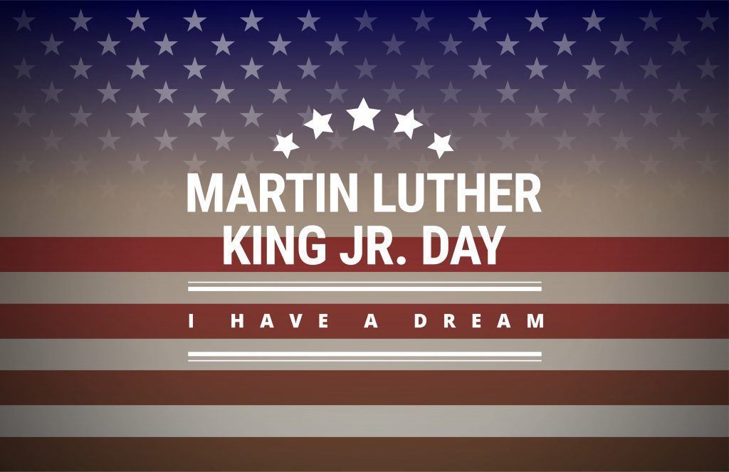 a photo of an american flag with text laid overtop reading "Martin Luther King Jr. Day" 