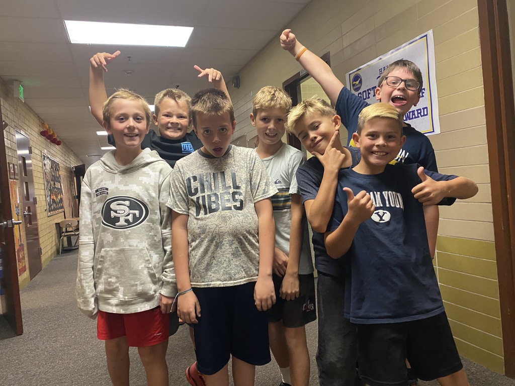 A photo of fifth grade boys pulling funny faces.