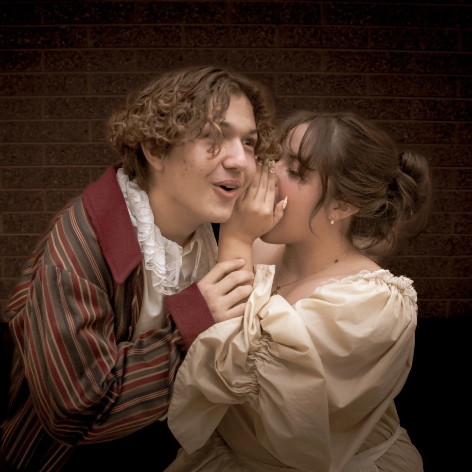 Two students posing for a picture dressed in Les Mis costumes