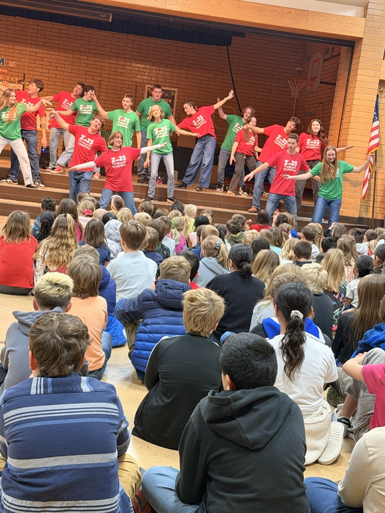 Madrigals singing for students in assembly!