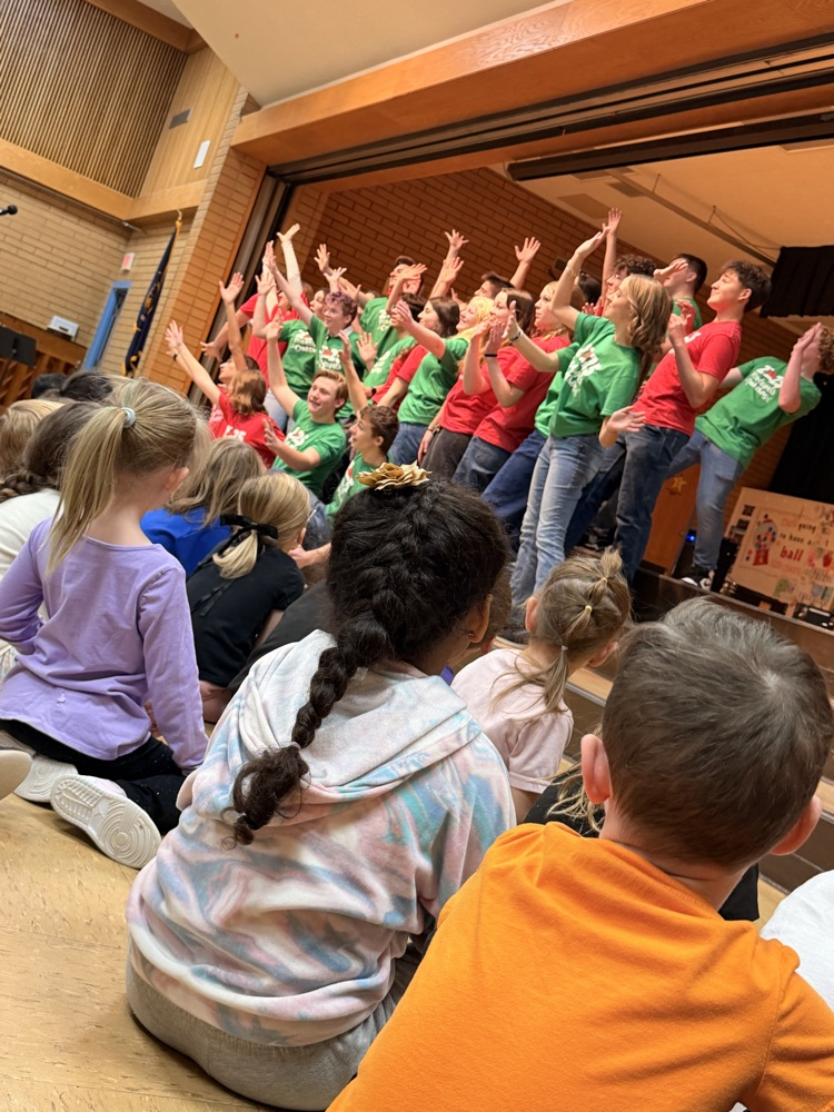 Madrigals singing for students in assembly!