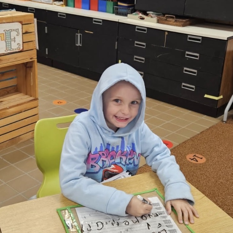 kindergarten students practicing writing skills