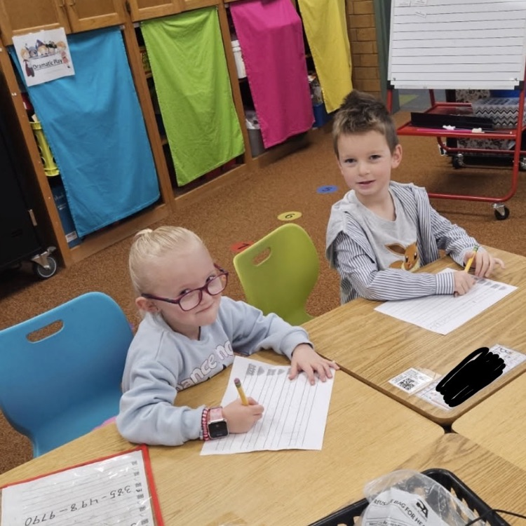 kindergarten students practicing writing skills