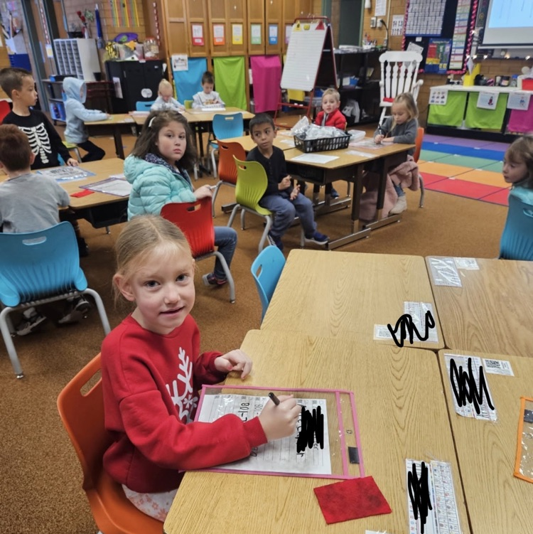 kindergarten students practicing writing skills