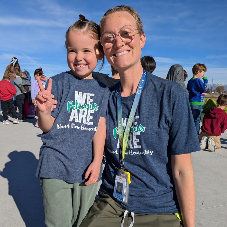 Recess supervisor and kindergartener both in IVE t-shirts