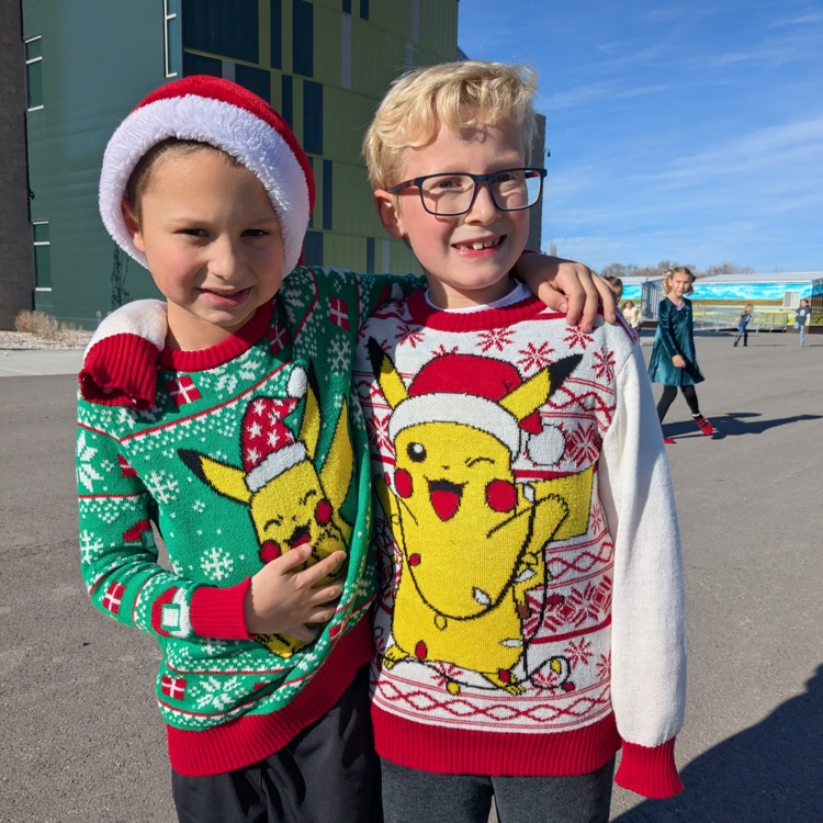 Two second grade students in pikachu sweaters