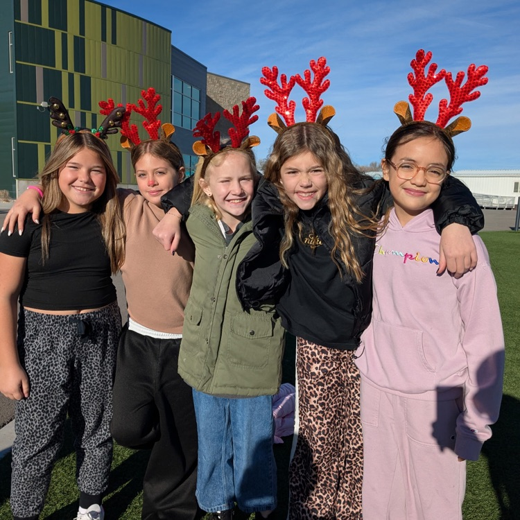 five fifth grade girls with reindeer antlers