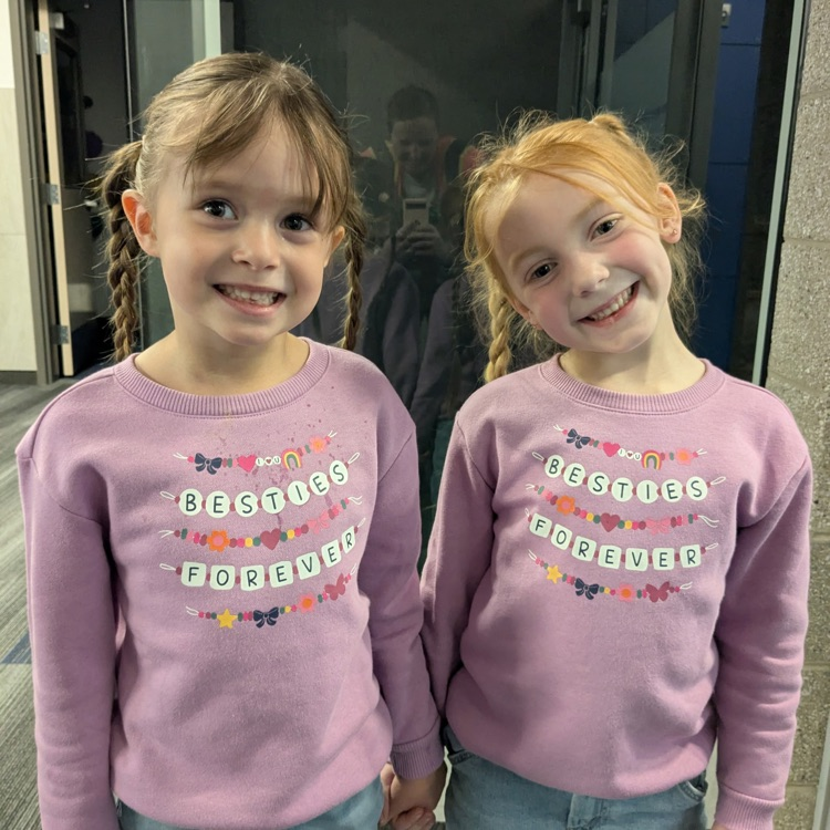 two students with besties forever sweatshirts