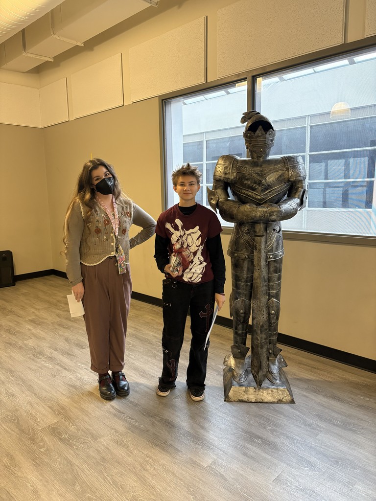 images of students standing next to teachers and a knight statue