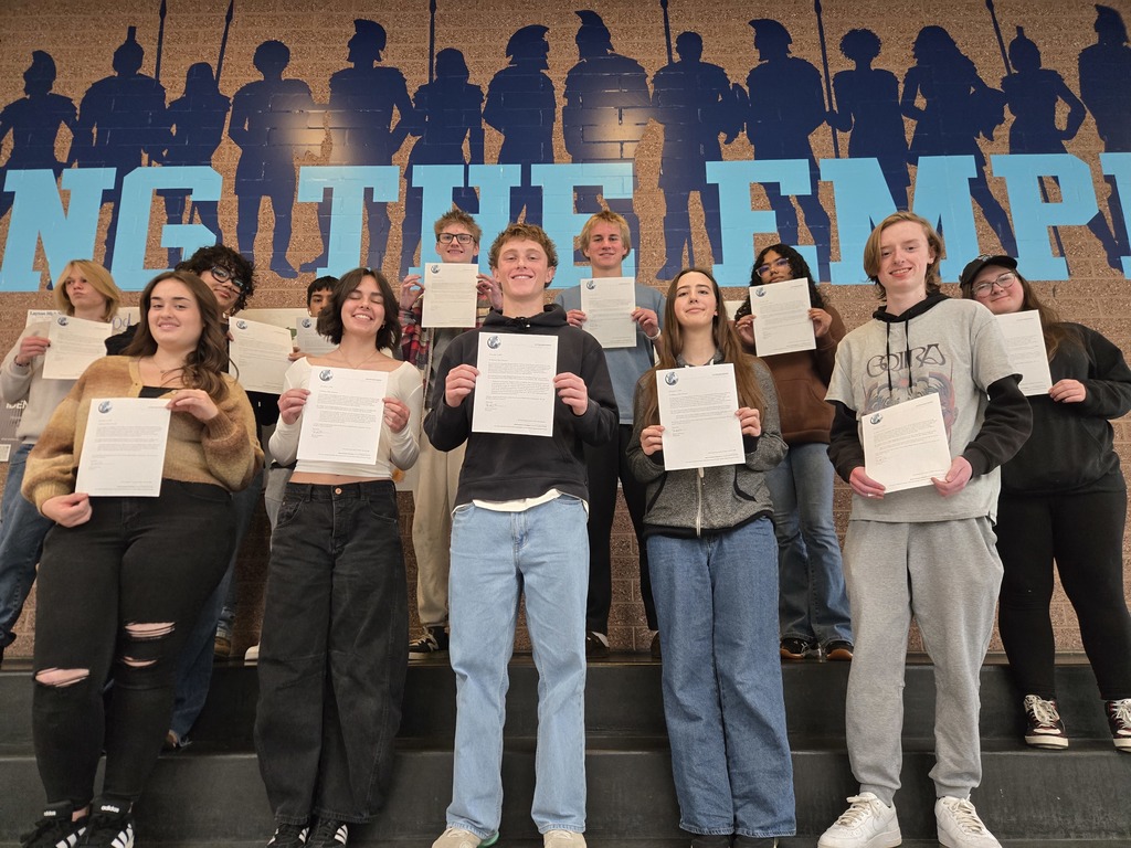 students of the Month holding up their letters proudly