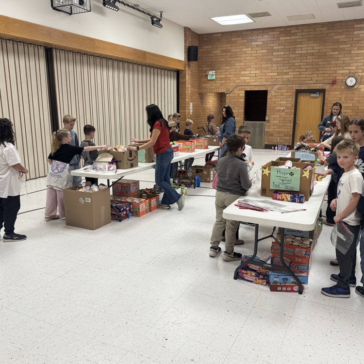 Columbia students making food packs  