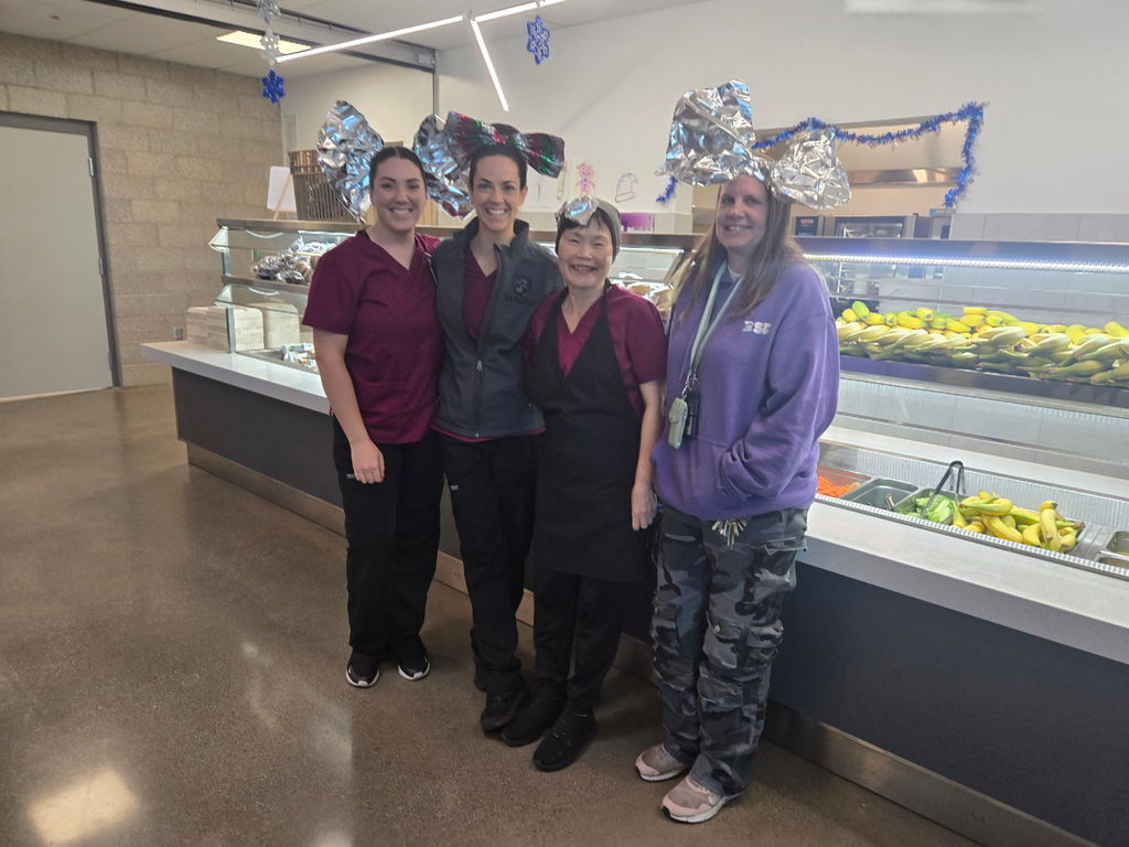 4 ladies wearing aluminum foil head bows