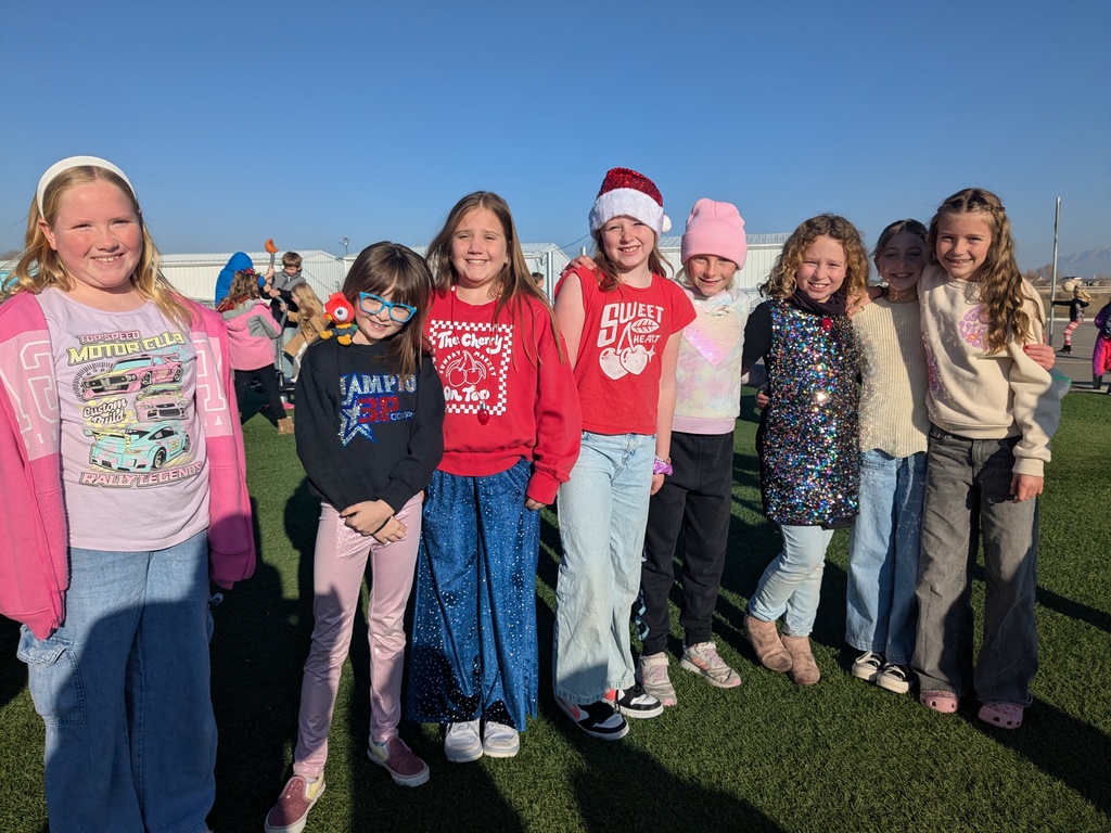 a group of girls smiling outside