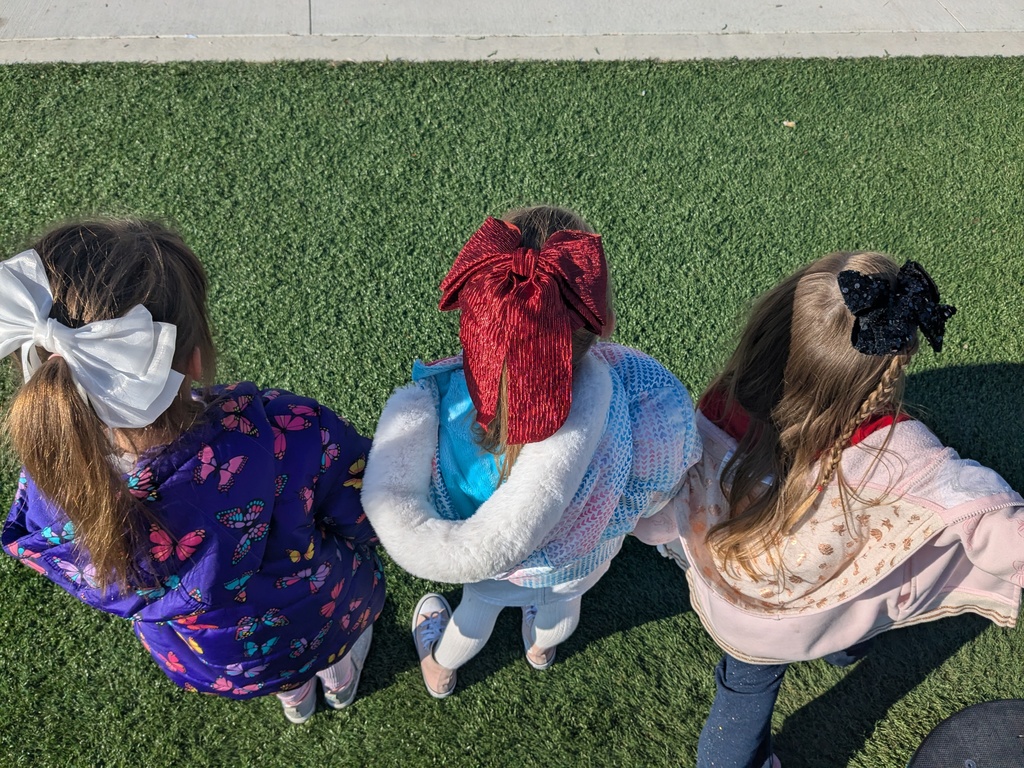 3 girls earing glittery bows