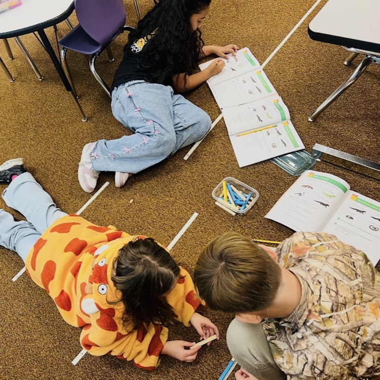 2nd graders learning about measurement 