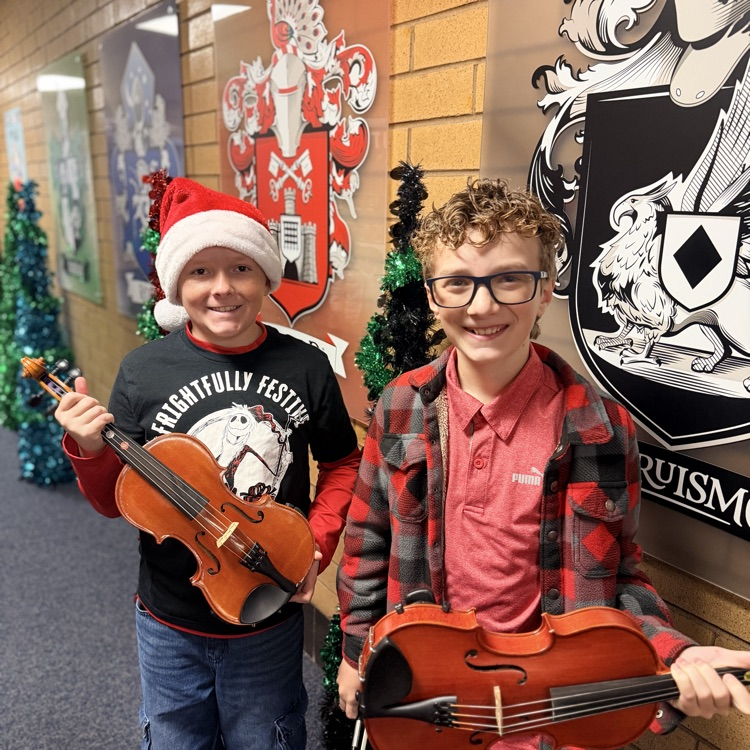 Orchestra students playing music in the hallway!