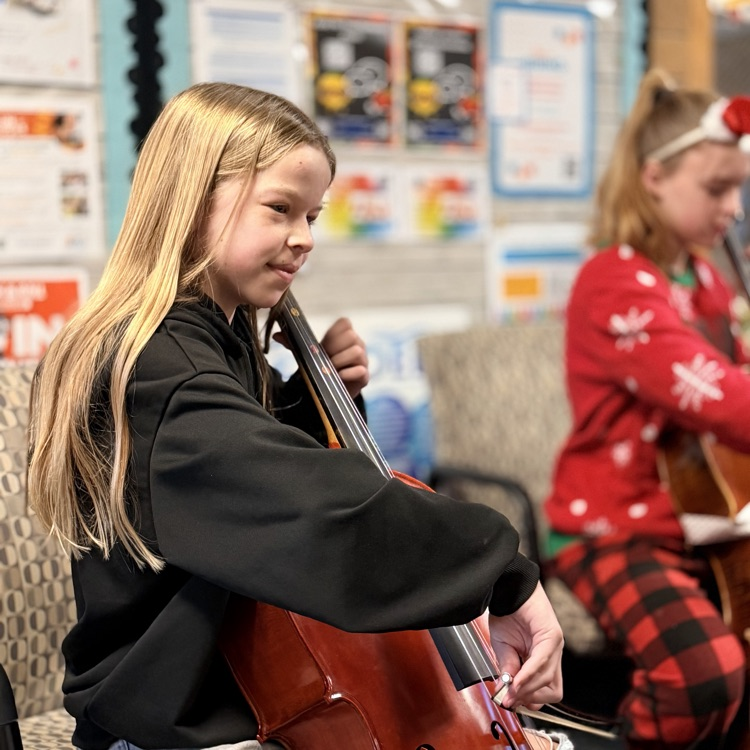 Orchestra students playing music in the hallway!