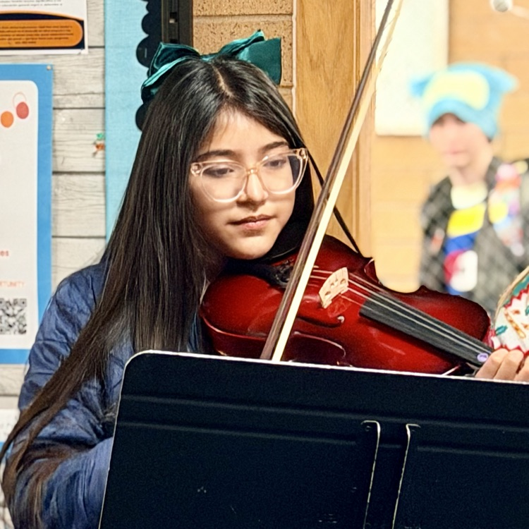 Orchestra students playing music in the hallway!