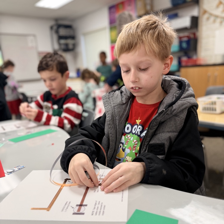 Students in STEM creating light up cards!