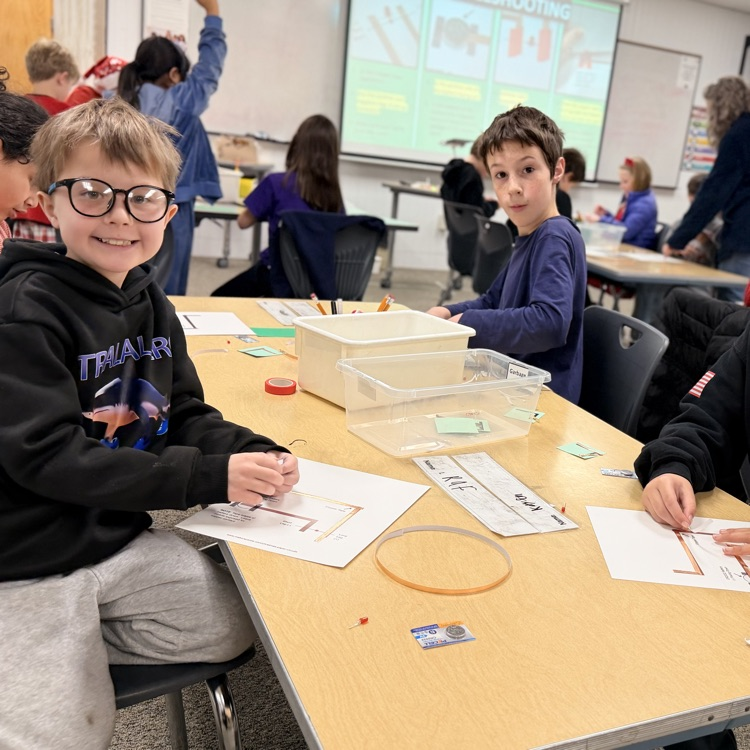 Students in STEM creating light up cards!