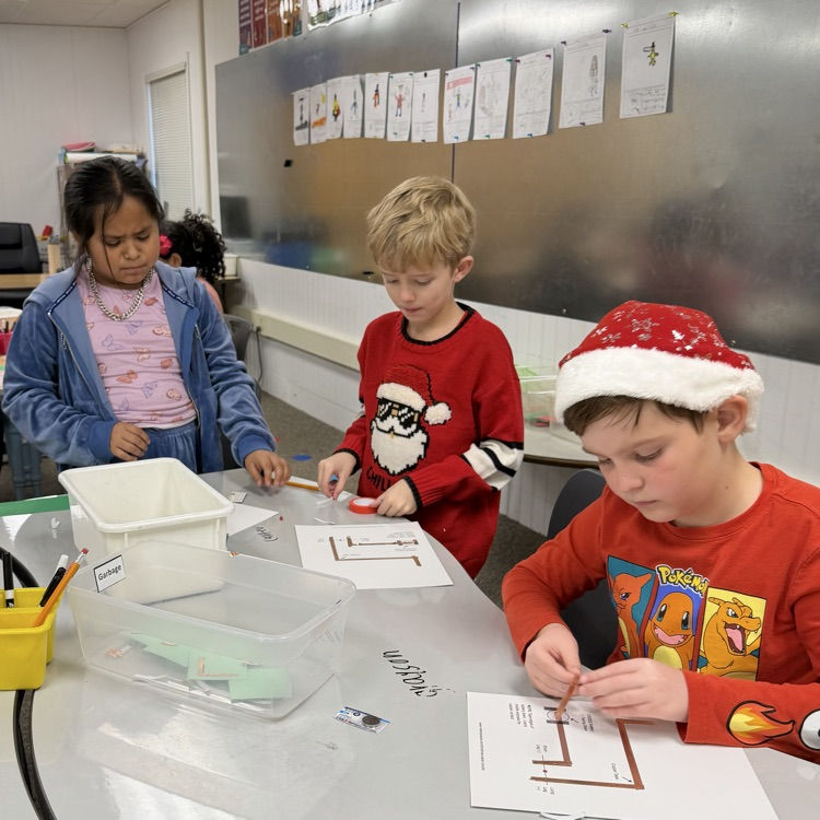 Students in STEM creating light up cards!