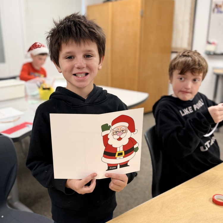 Students in STEM creating light up cards!