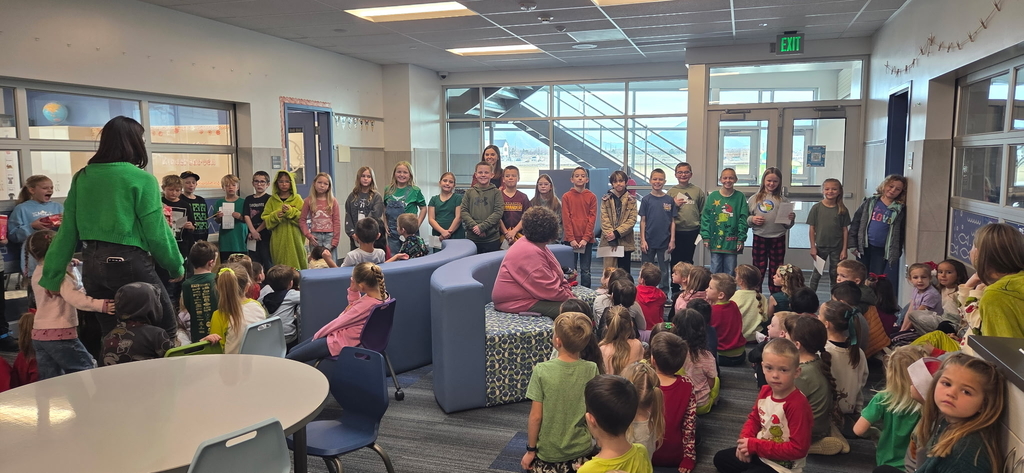 a large group of students sitting around laughing