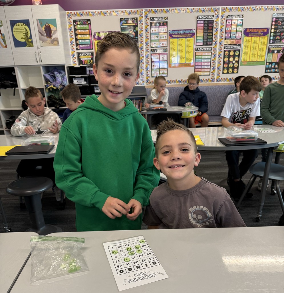 2 boys smiling while playing bingo