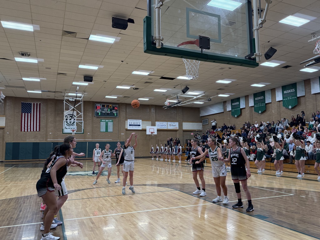 Student shooting a free-throw. 