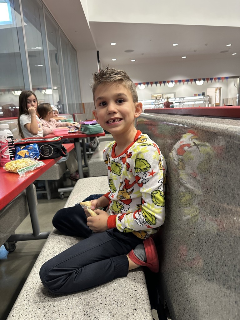 Student wearing a Grinch shirt.
