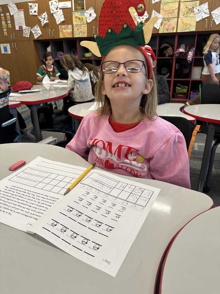 Student wearing an elf hat. 