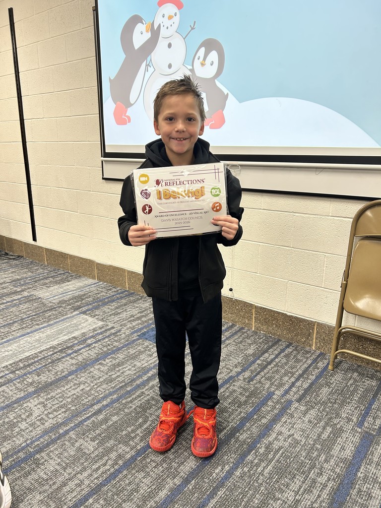 Reflections winners standing with their certificates with the theme I Belong!