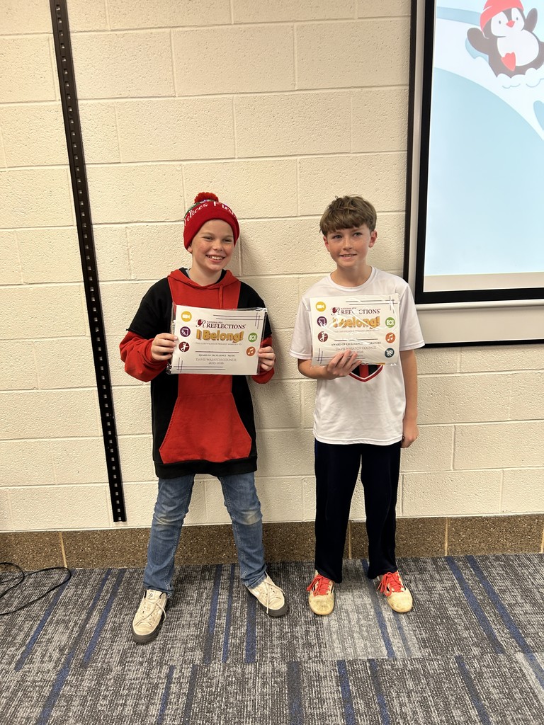 Reflections winners standing with their certificates with the theme I Belong!