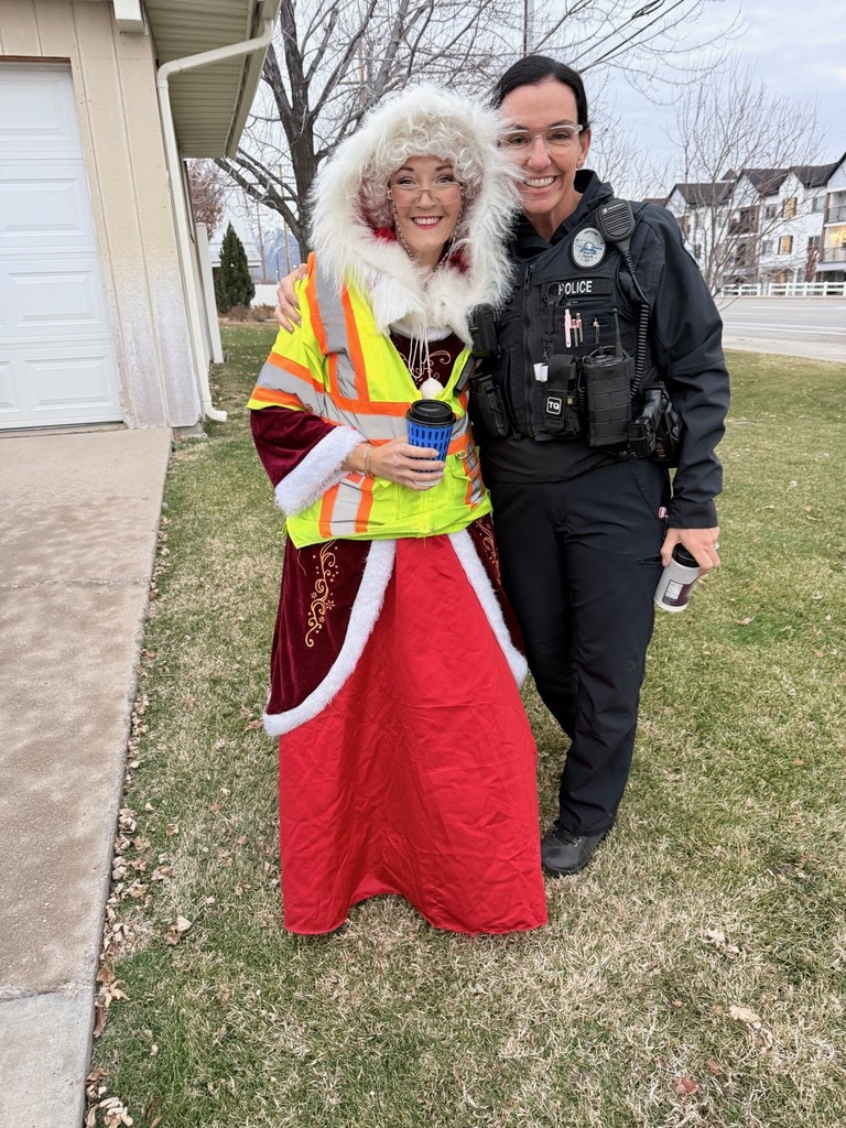 Officer and crossing guard embrace with hot chocolate and warm smiles for collaboration