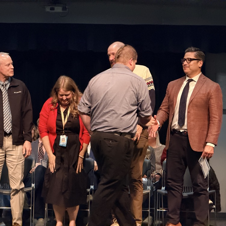 shaking hands of the graduates 