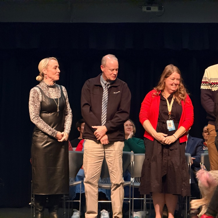 shaking hands of graduates