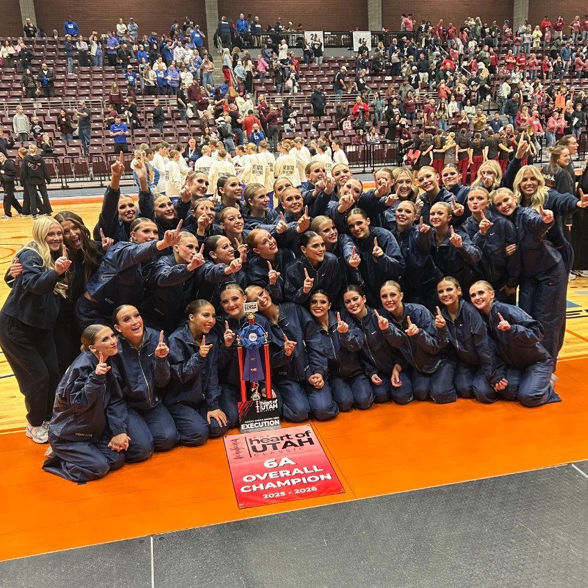 Lancelles posing for a group picture with their first place trophy 