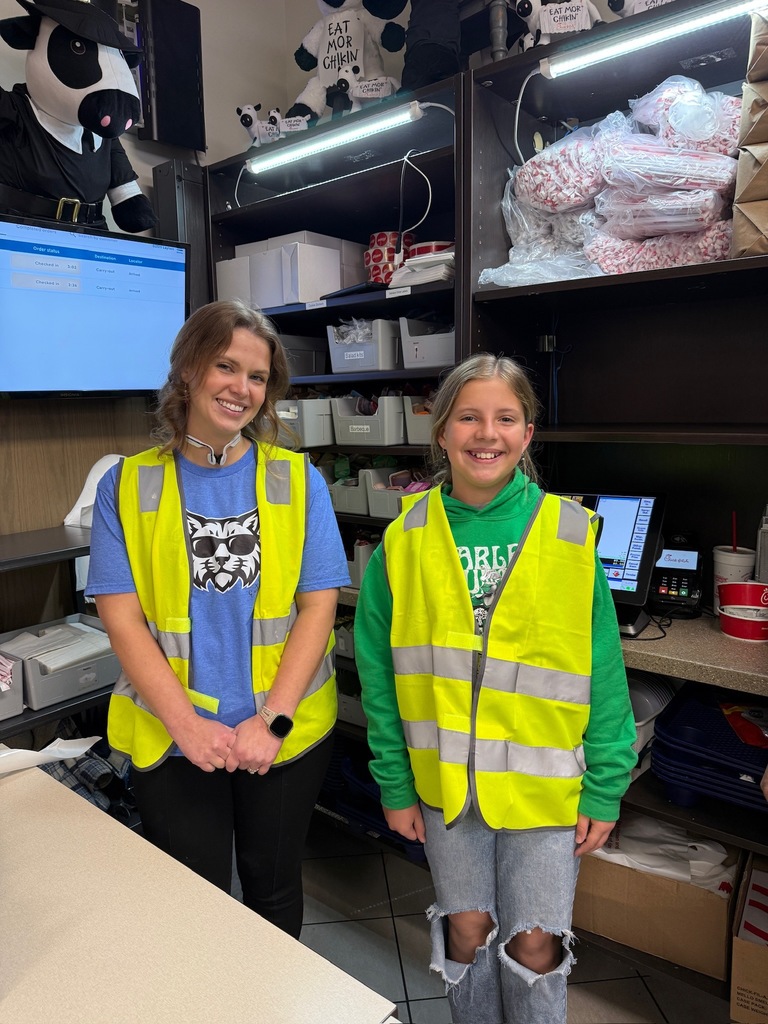 Parent and student working at school fundraiser