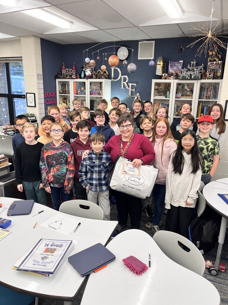 Ms. Lloyd and her students in her classroom after being recognized as teacher leader.