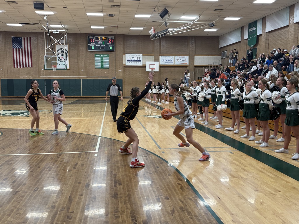 Girl dribbling the ball. 