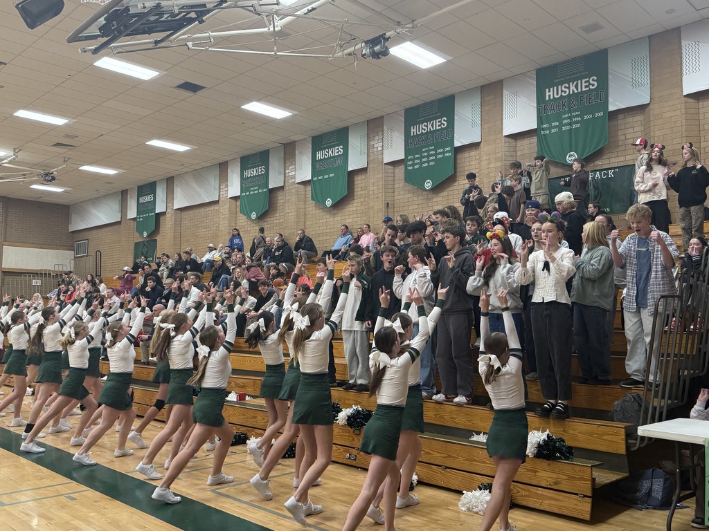 Cheerleaders and fans cheering on our team. 