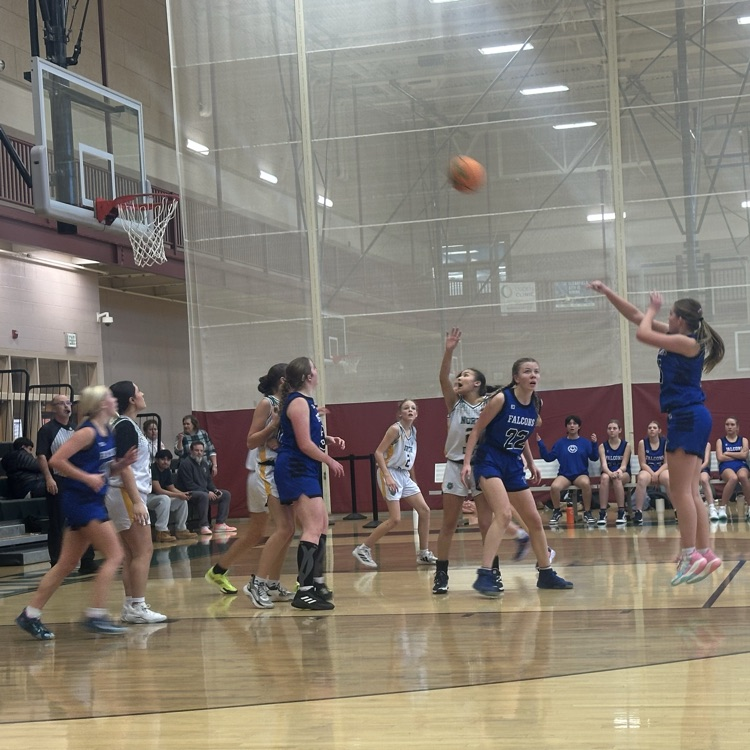 student shooting the ball