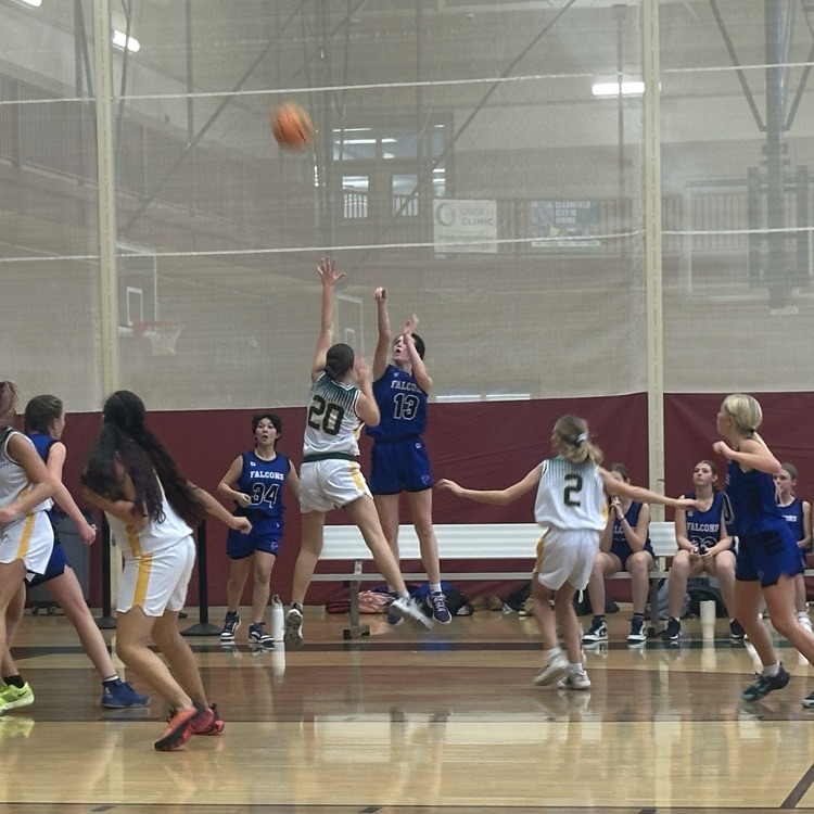 student shooting the ball