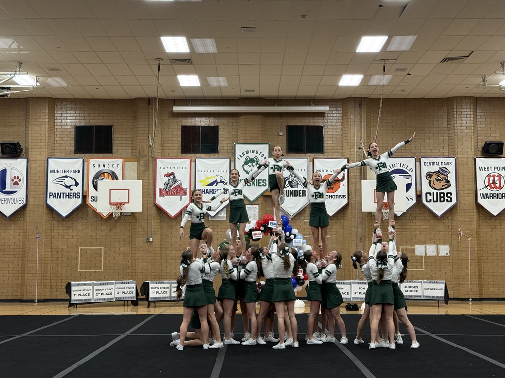 Cheer performing their Show routine - pyramid. 